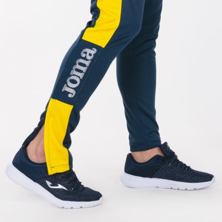 Спортивні штани Joma Champion IV 100761.309 колір: темно-синій/жовтий